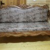 Leather sofa with carved wood trim will be a real finding for your living room.