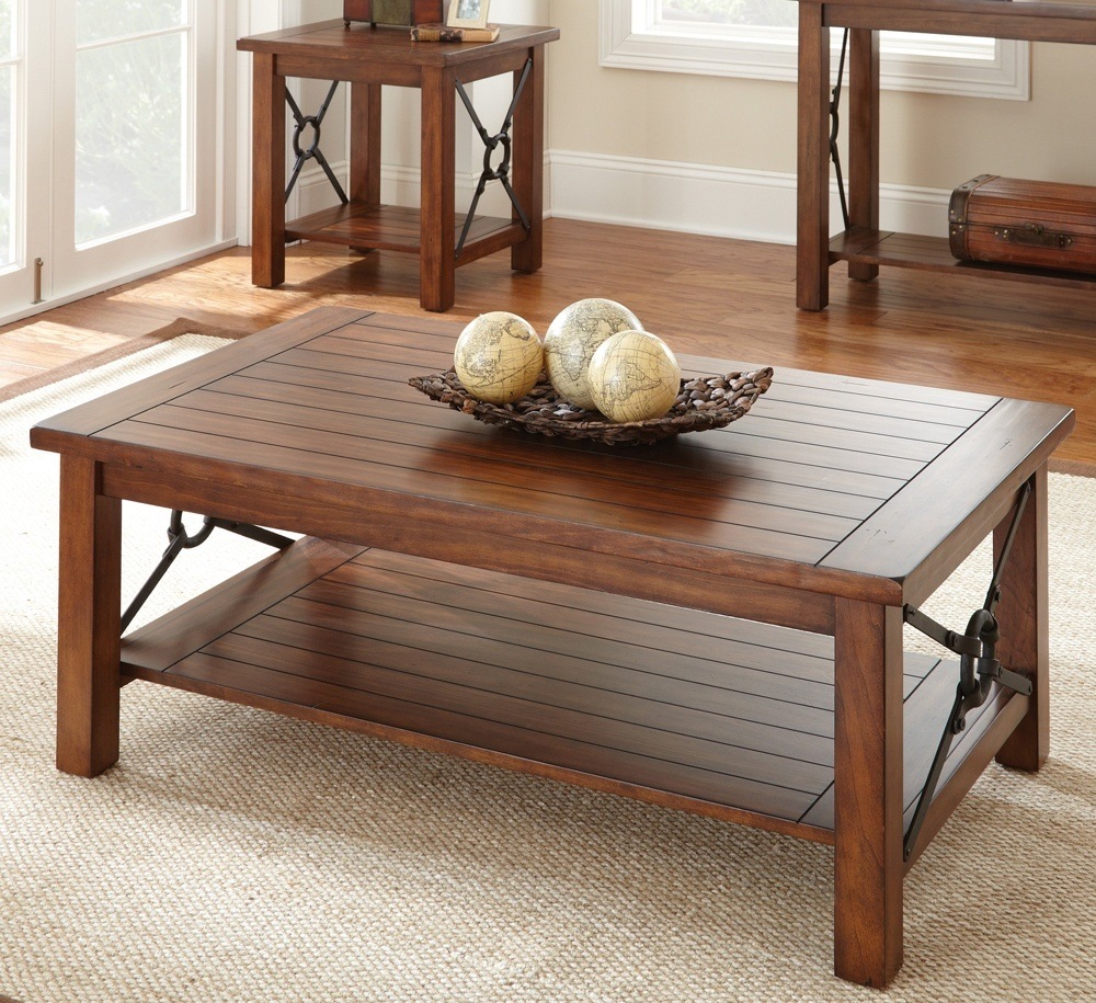 Solid wood rectangular coffee table with rough wood and metal holders will beautify any interior.