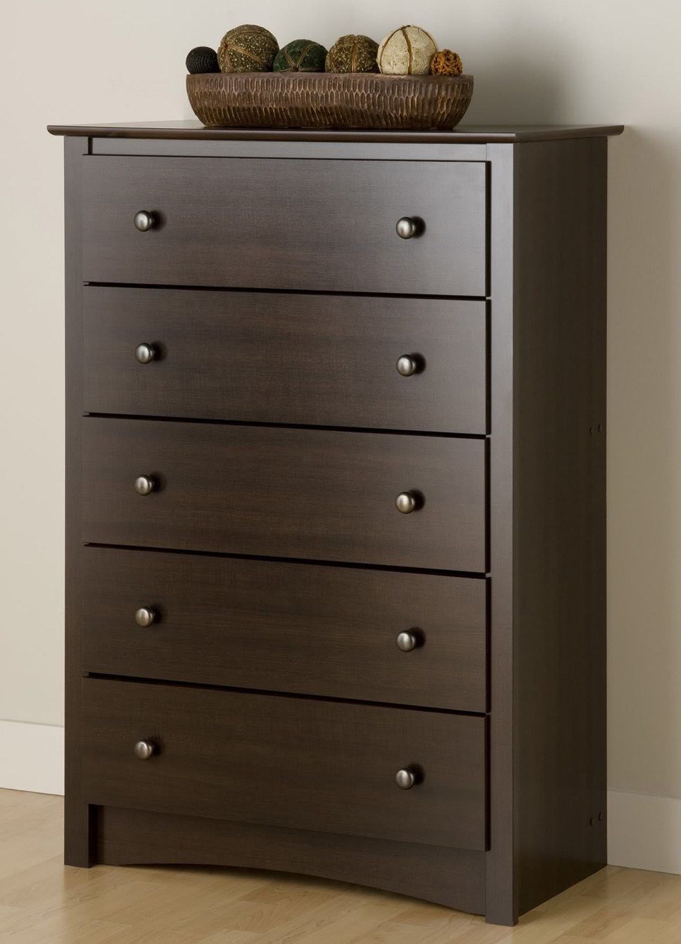 A large tall brown dresser is necessary and comfortable piece of furniture.