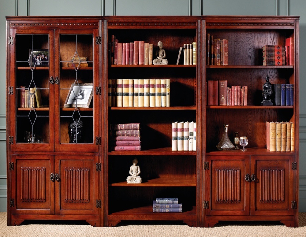 Cherry wood bookcase with doors which is made of solid tree is well-protected from mechanical and thermal influences.