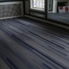 Dark gray hardwood floors may be chosen for living areas in different homes.