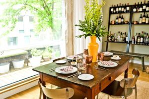 Try to mix small country furniture with the modern dining area.