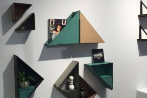 The triangle shaped bookshelf with a quirky contemporary twist has a name the Flip Shelf.