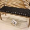 The construction of unique wood bench frame is angular and geometric.