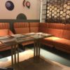Bistro Style Corner Bench-Sofa In Orange Color With Geometric Design