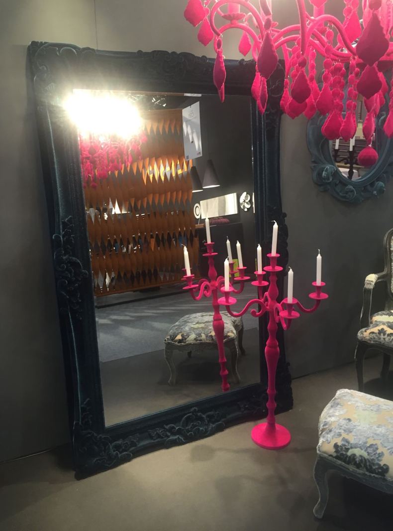 Black Frame Mirror On The Floor With Pink Candelabra