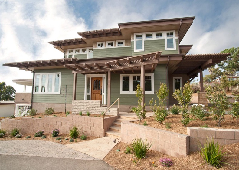 Designers propose to add some soft sage green exterior house paint.