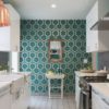 Bright and eye-catching galley wallpaper can help to take a break with this efficient small kitchen design.