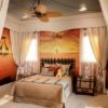 African themed bedroom furniture with a safari theme includes soft and rich animal pelts.