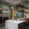 Kitchen With Brass Accents And Marble